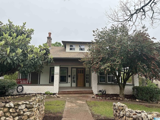 1730 Cullom St S, Birmingham, AL 35205 - view of front of home featuring brick siding, a shingled roof, covered porch, and a chimney