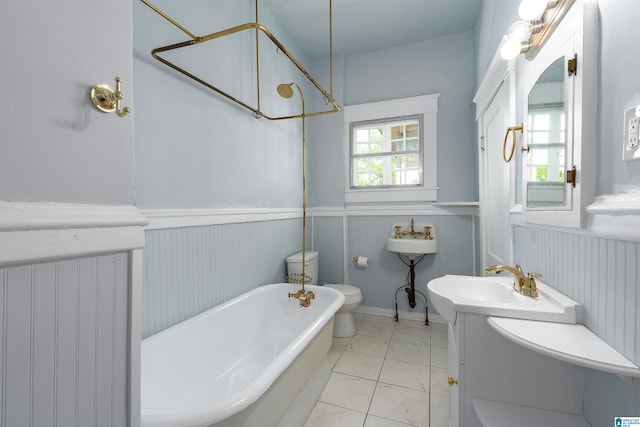1730 Cullom St S, Birmingham, AL 35205 - full bath featuring walk in shower, a freestanding tub, a sink, and a wainscoted wall