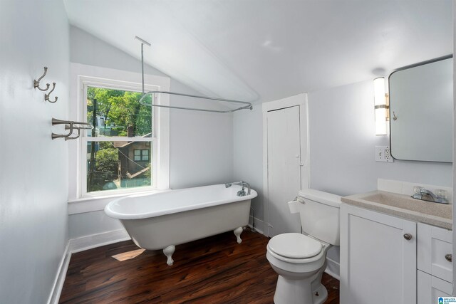 1730 Cullom St S, Birmingham, AL 35205 - full bathroom featuring a freestanding tub, vanity, toilet, wood finished floors, and lofted ceiling