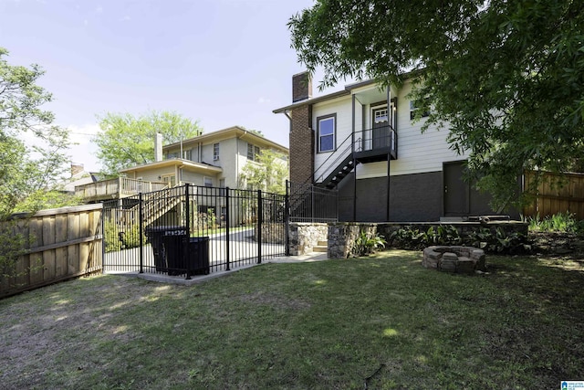 1730 Cullom St S, Birmingham, AL 35205 - rear view of house featuring a chimney, stairs, fence, and a lawn