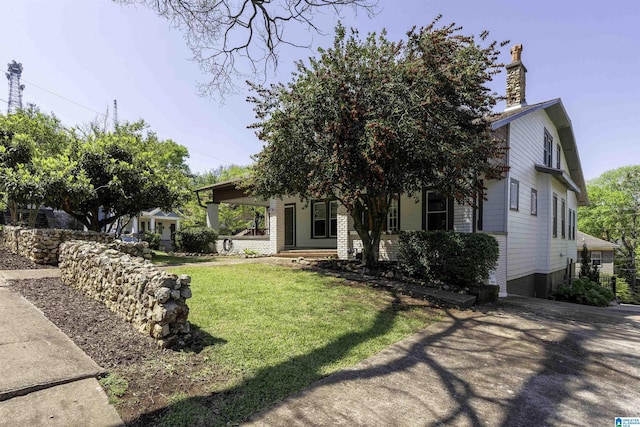 1730 Cullom St S, Birmingham, AL 35205 - view of front facade with a porch, a chimney, and a front lawn