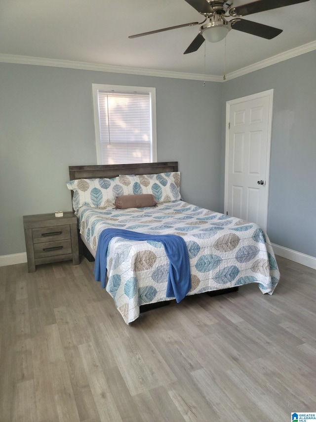 627 Sidney Cir, Anniston, AL 36207 - bedroom featuring baseboards, a ceiling fan, wood finished floors, and ornamental molding