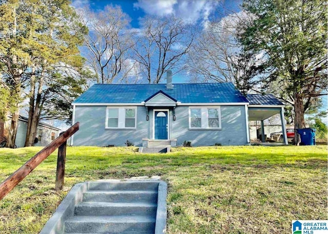 627 Sidney Cir, Anniston, AL 36207 - view of front of property featuring a standing seam roof, a front lawn, brick siding, and metal roof