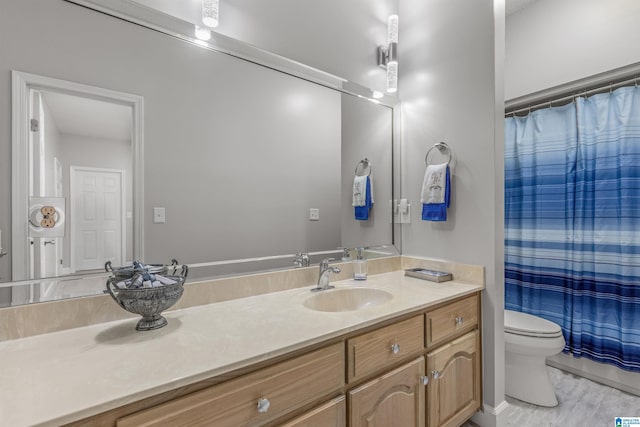 full bath with vanity, a shower with curtain, toilet, and wood finished floors