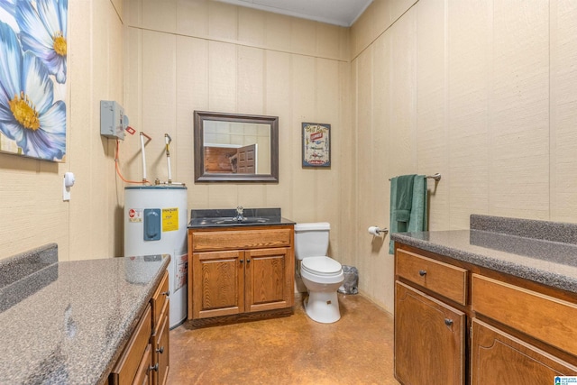bathroom with water heater, vanity, and toilet