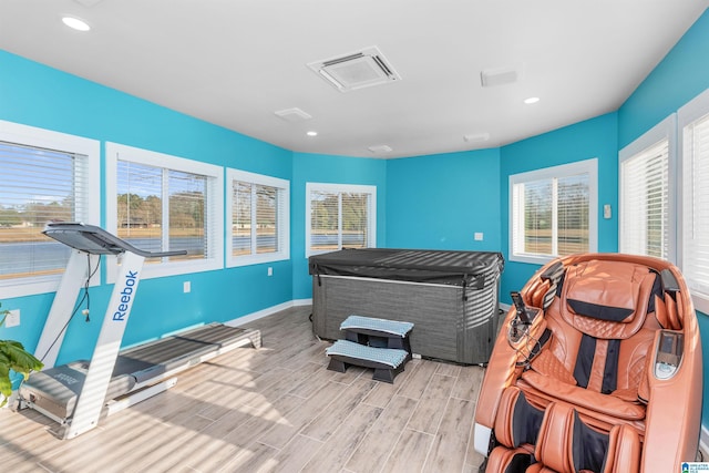 bedroom with visible vents, baseboards, wood finish floors, and recessed lighting