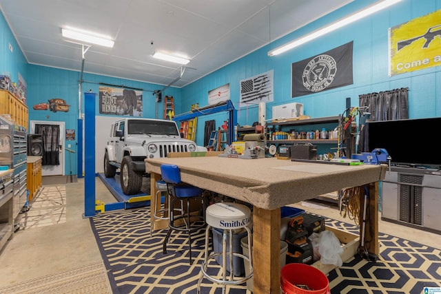 game room featuring concrete floors