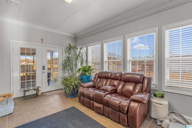 sunroom with tile patterned flooring, french doors, visible vents, and ornamental molding