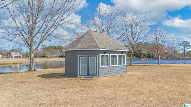 view of outbuilding featuring an outdoor structure and a water view