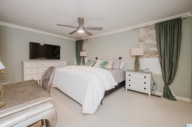 bedroom featuring crown molding, light colored carpet, baseboards, and a ceiling fan