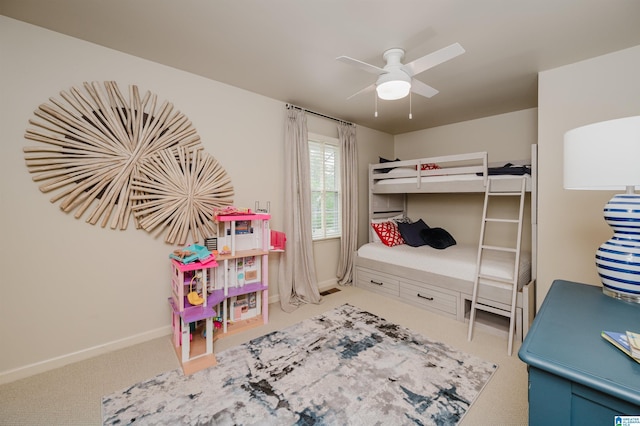 carpeted bedroom with baseboards and ceiling fan