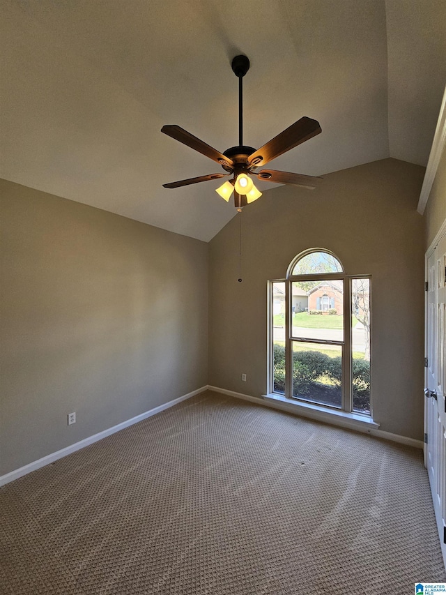 unfurnished room featuring carpet flooring, baseboards, lofted ceiling, and ceiling fan