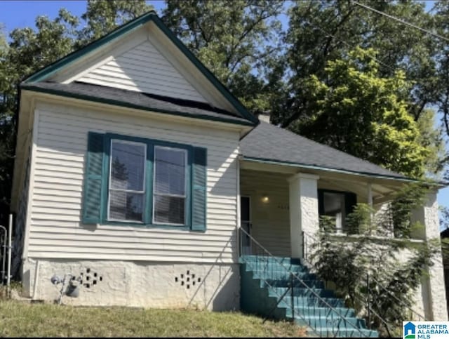 view of front of house with a porch and stairway