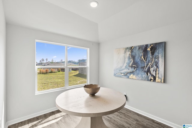 dining room with baseboards and wood finished floors