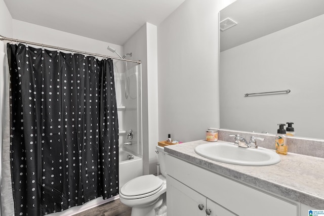 bathroom featuring wood finished floors, vanity, visible vents, toilet, and shower / bath combo with shower curtain