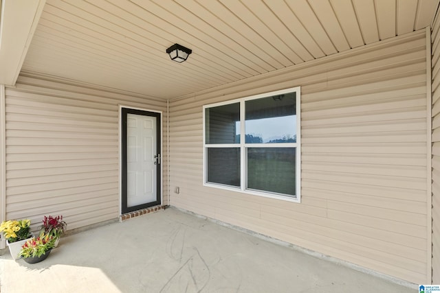 property entrance with a patio area