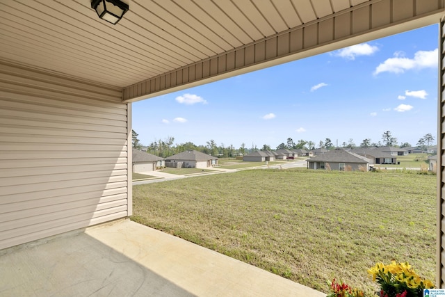 view of yard with a patio area and a residential view