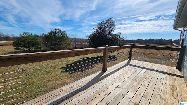 wooden deck featuring a rural view