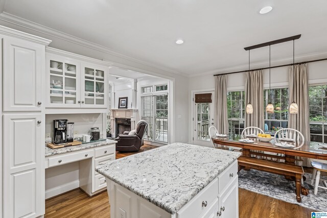 5006 Aberdeen Way, Hoover, AL 35242 - kitchen featuring light wood-type flooring, ornamental molding, and light stone countertops