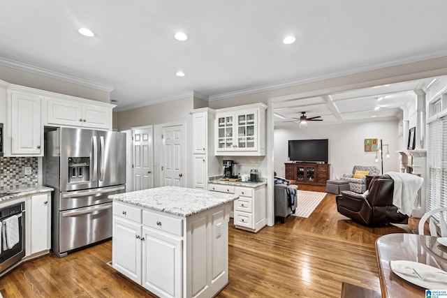 5006 Aberdeen Way, Hoover, AL 35242 - kitchen featuring open floor plan, ceiling fan, appliances with stainless steel finishes, wood finished floors, and backsplash
