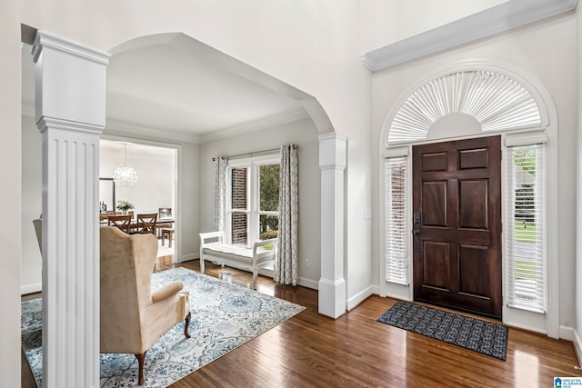 5006 Aberdeen Way, Hoover, AL 35242 - foyer featuring baseboards, crown molding, ornate columns, arched walkways, and wood finished floors