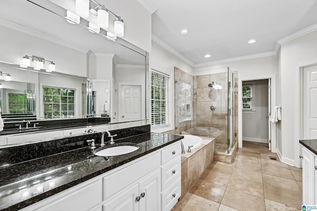 5006 Aberdeen Way, Hoover, AL 35242 - full bathroom featuring crown molding, a garden tub, a stall shower, and a healthy amount of sunlight