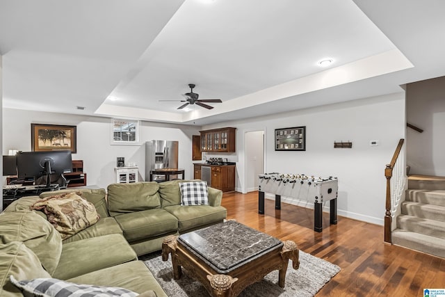 5006 Aberdeen Way, Hoover, AL 35242 - living area featuring baseboards, wet bar, a tray ceiling, ceiling fan, and wood finished floors