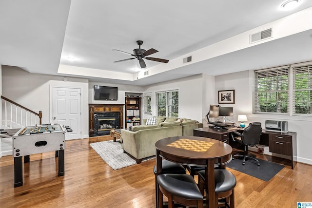 5006 Aberdeen Way, Hoover, AL 35242 - interior space featuring light wood finished floors, visible vents, a raised ceiling, and a ceiling fan