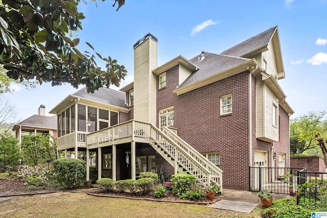 5006 Aberdeen Way, Hoover, AL 35242 - back of property with stairway, a sunroom, brick siding, a garage, and fence
