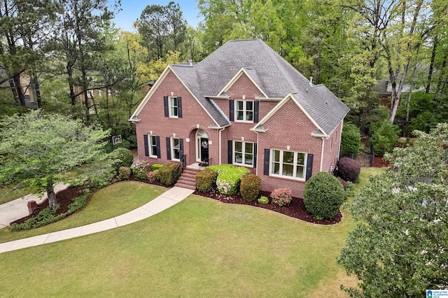 5006 Aberdeen Way, Hoover, AL 35242 - traditional-style house featuring a front yard, brick siding, and a shingled roof
