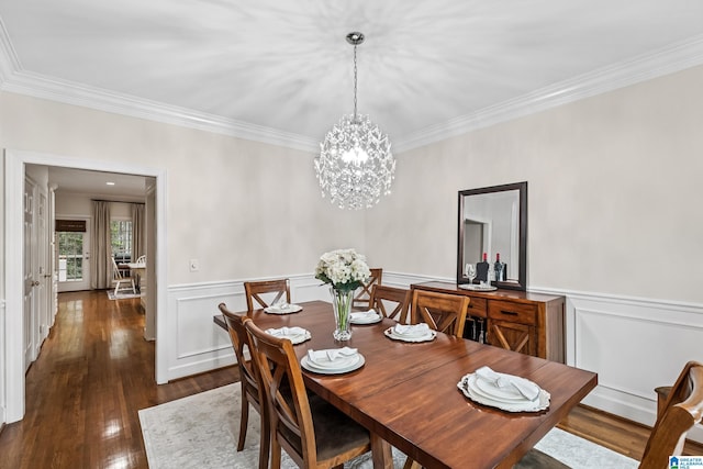 5006 Aberdeen Way, Hoover, AL 35242 - dining area featuring wainscoting, an inviting chandelier, crown molding, and wood finished floors