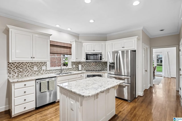 5006 Aberdeen Way, Hoover, AL 35242 - kitchen featuring white cabinetry, a center island, appliances with stainless steel finishes, wood finished floors, and a sink
