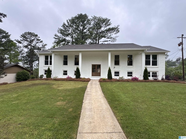 view of front of house featuring french doors and a front lawn