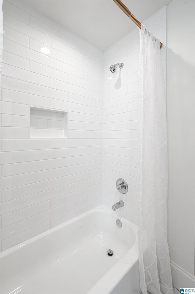full bathroom with shower / tub combo with curtain