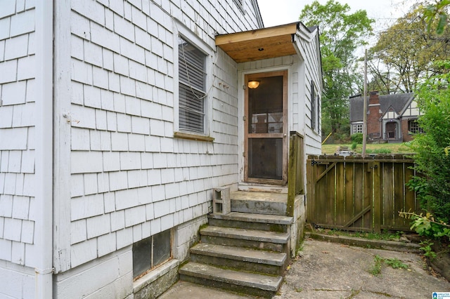 view of exterior entry with fence