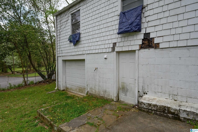 garage with fence