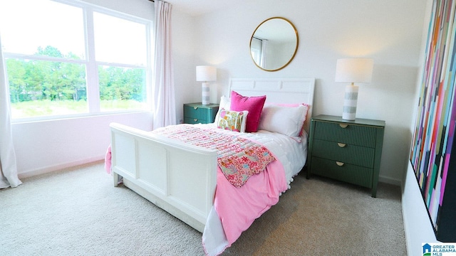 carpeted bedroom with baseboards