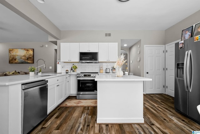 5544 Colony Ln, Hoover, AL 35226 - kitchen featuring dark wood-type flooring, tasteful backsplash, visible vents, appliances with stainless steel finishes, and a sink