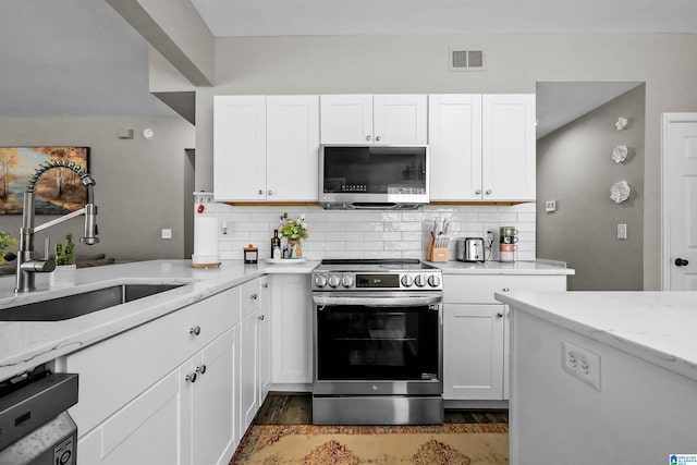 5544 Colony Ln, Hoover, AL 35226 - kitchen featuring appliances with stainless steel finishes, a sink, white cabinetry, and visible vents