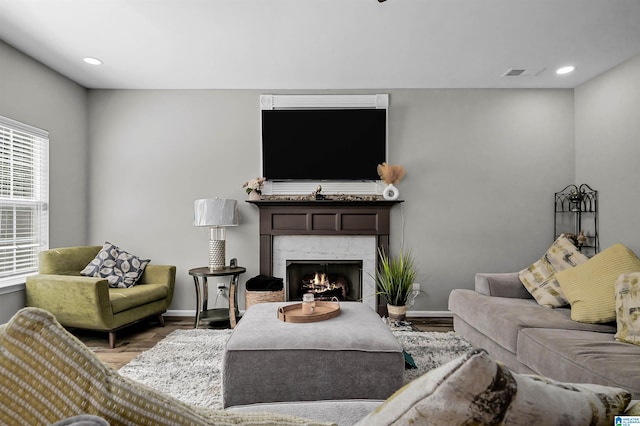 5544 Colony Ln, Hoover, AL 35226 - living area with visible vents, a premium fireplace, baseboards, and wood finished floors