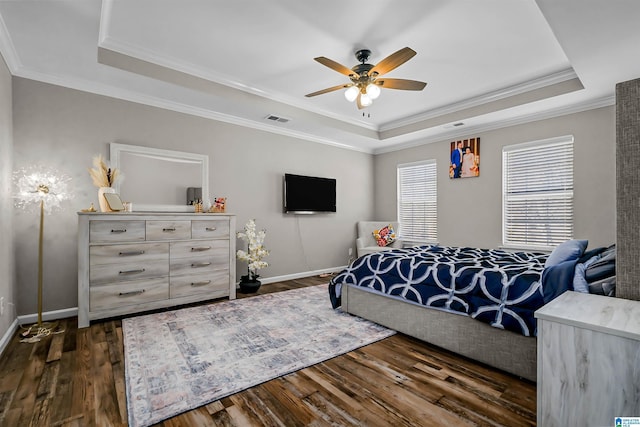 5544 Colony Ln, Hoover, AL 35226 - bedroom with visible vents, a tray ceiling, crown molding, and dark wood finished floors
