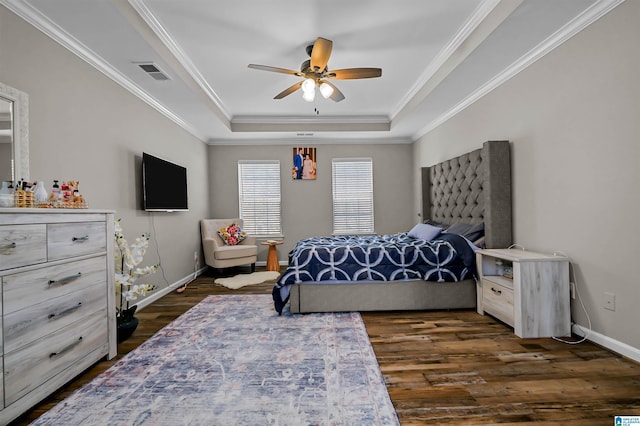 5544 Colony Ln, Hoover, AL 35226 - bedroom featuring dark wood-type flooring, visible vents, a tray ceiling, and ornamental molding