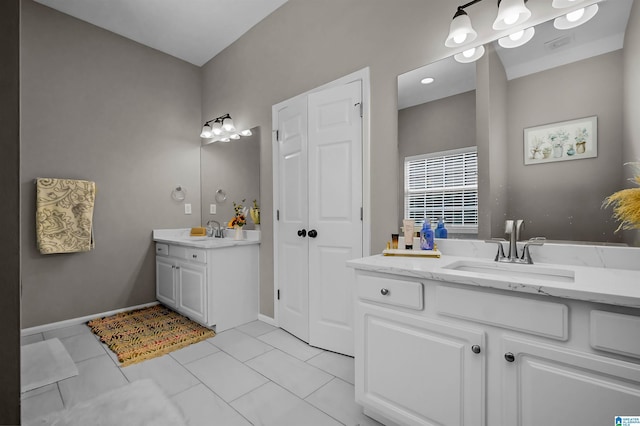 5544 Colony Ln, Hoover, AL 35226 - bathroom featuring tile patterned floors, two vanities, and a sink