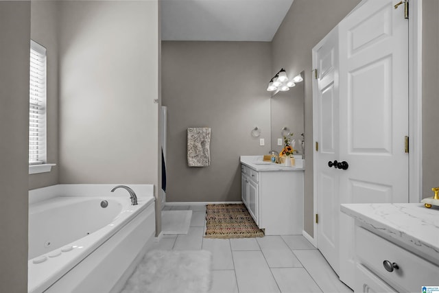 5544 Colony Ln, Hoover, AL 35226 - full bathroom featuring tile patterned flooring, a jetted tub, vanity, and a healthy amount of sunlight