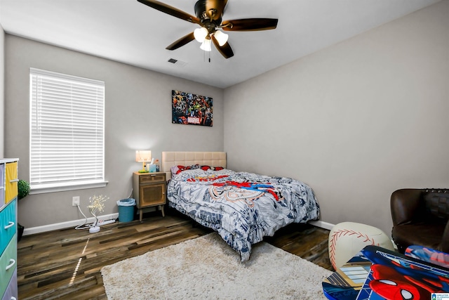 5544 Colony Ln, Hoover, AL 35226 - bedroom featuring multiple windows, baseboards, a ceiling fan, and wood finished floors