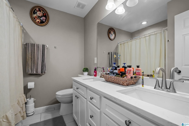 5544 Colony Ln, Hoover, AL 35226 - bathroom featuring tile patterned flooring, visible vents, a sink, and toilet