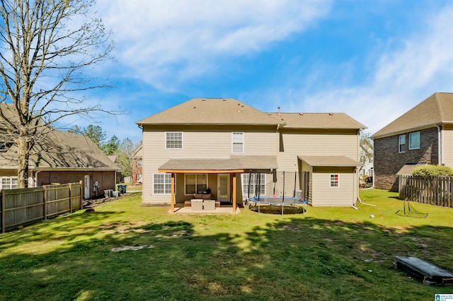 5544 Colony Ln, Hoover, AL 35226 - rear view of house featuring a storage shed, an outdoor structure, a lawn, a patio, and a trampoline