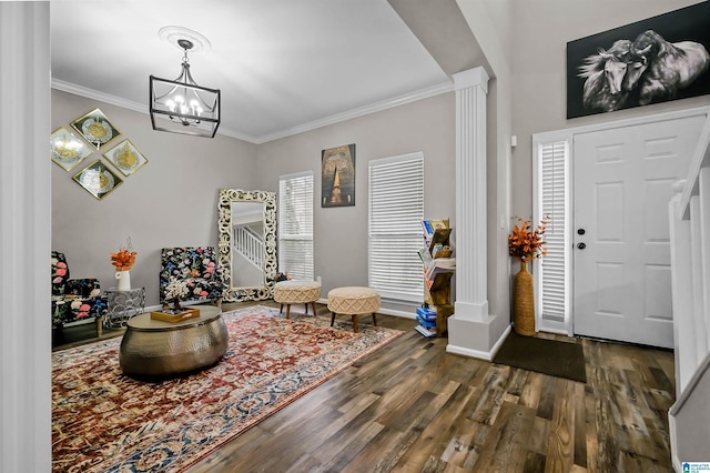 5544 Colony Ln, Hoover, AL 35226 - foyer entrance featuring baseboards, an inviting chandelier, ornamental molding, decorative columns, and wood finished floors