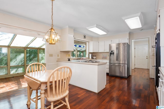kitchen featuring stainless steel refrigerator with ice dispenser, a peninsula, dark wood-style floors, and a notable chandelier