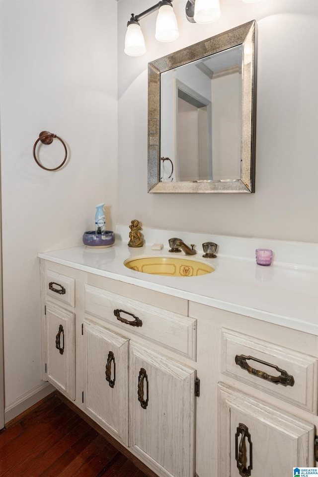 bathroom with vanity and wood finished floors
